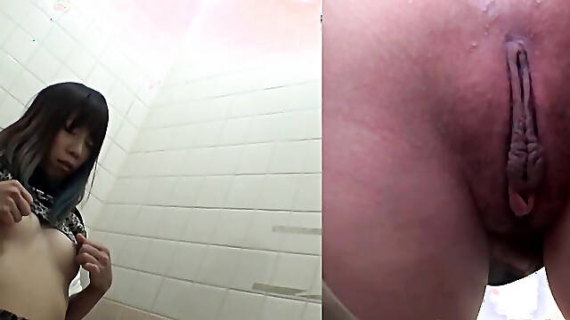 Naughty Japanese babe fingers her pussy in public toilet