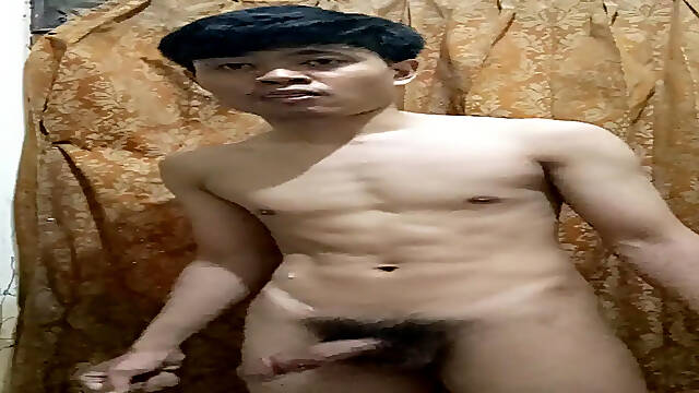 Asian boy strokes his thick cock until he cums