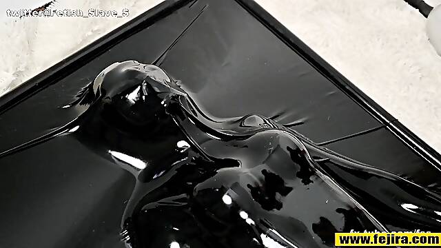 Fejira com Orgasm in a more wrapped latex sleeping bag